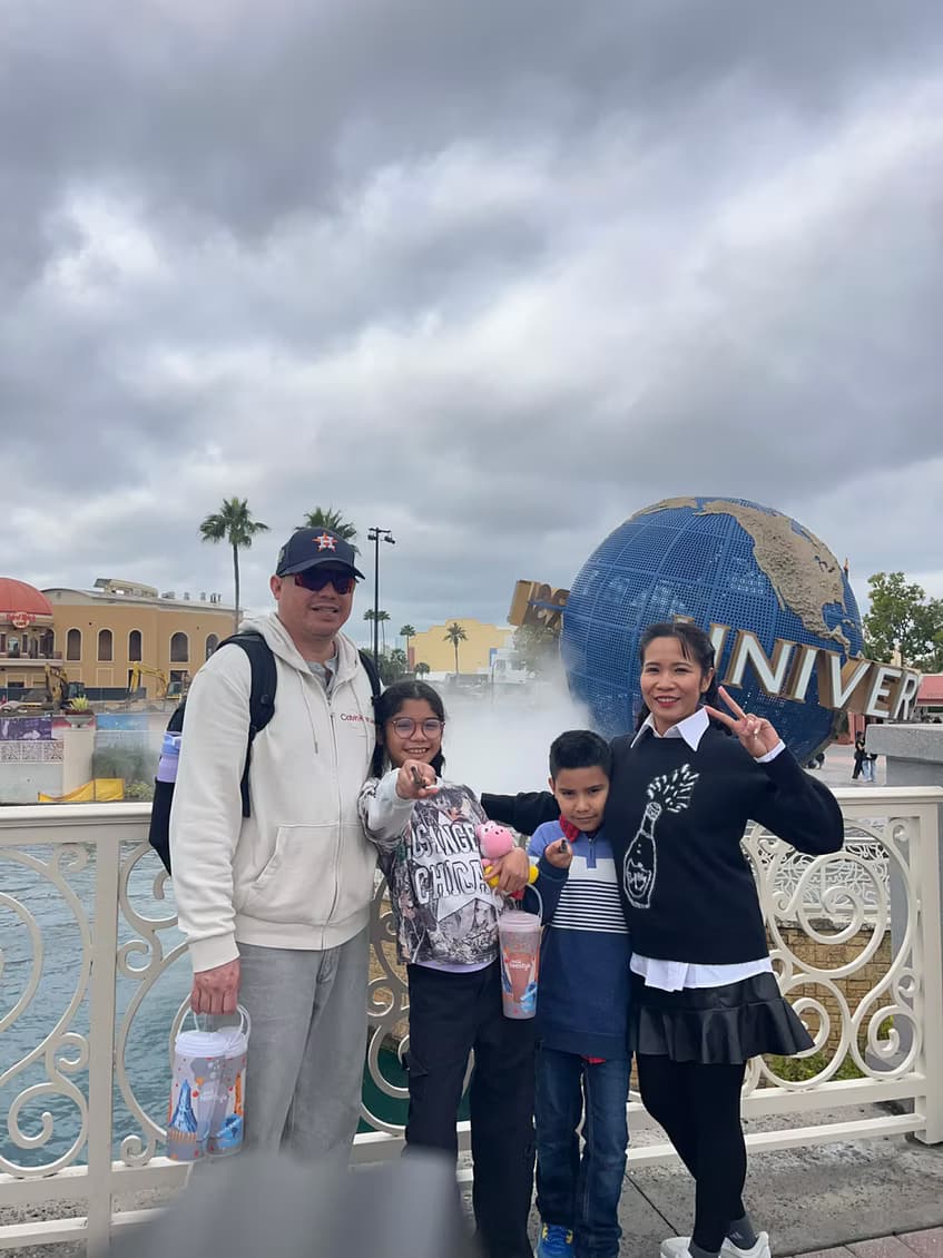 Canyesa and her family in front of the Universal Studios globe